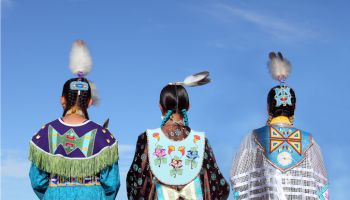 Native Americans in traditional dress at pow-wow
