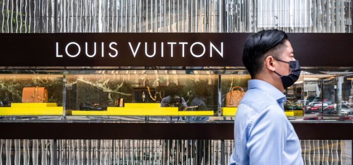 French luxury brand Louis Vuitton banner seen outside its retail