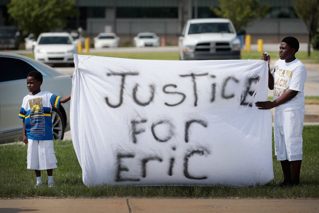 Demonstrators Hold A Protest Outside South Bend Police Station After Funeral For Eric Logan