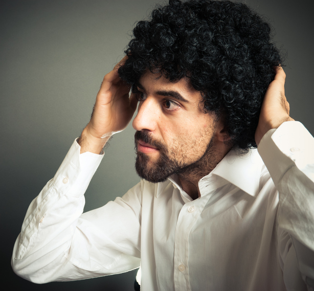 Blackhead Boy touching his hair in front of the mirror