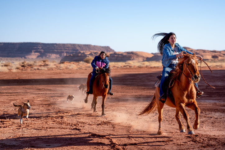Young Navajo Siblings Riding Their Horses