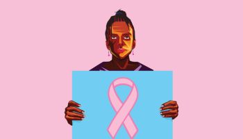 African American woman holding a poster with Pink ribbon for breast cancer awareness
