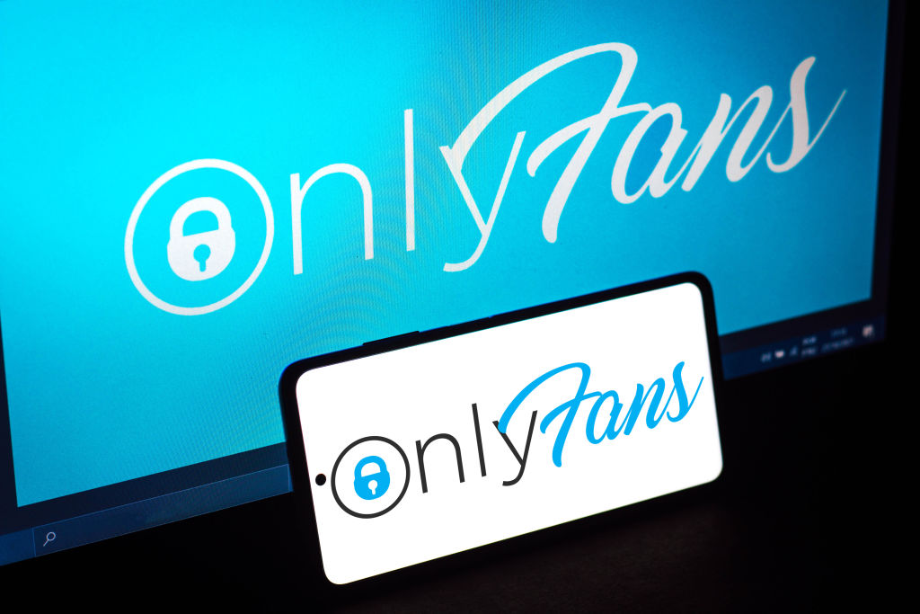 In this photo illustration, the OnlyFans logo seen displayed...