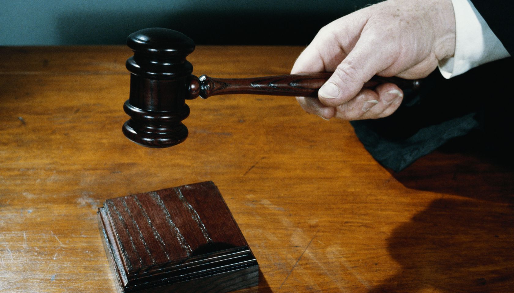 Close-up of judge holding gavel