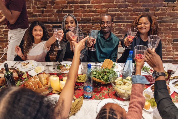 Multi-generation ethnic family having Thanksgiving dinner