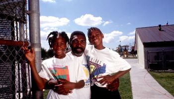 Tennis players Venus and Serena Williams pose in 1991 in Compton