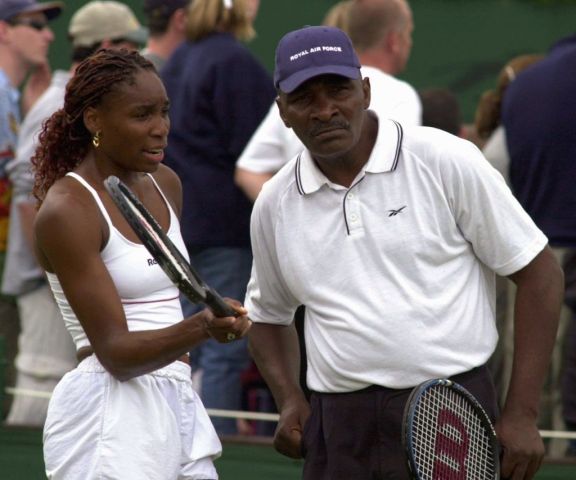 US player Venus Williams (L) and her father and co