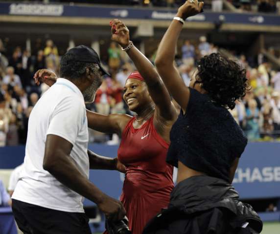 Serena Williams of the US (4) hugs her dad