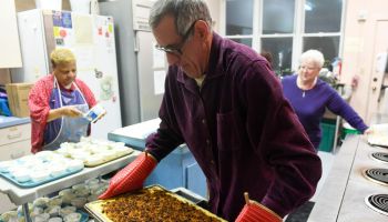 Weekly dinner volunteer John Estep of Reading moves a vat of macaroni and cheese in the church's kitchen. Hope Cafe, a new venture by Hope Lutheran Church, is planned to be a pay what you can restaurant in Reading, photographed on Tuesday, December 11, 20
