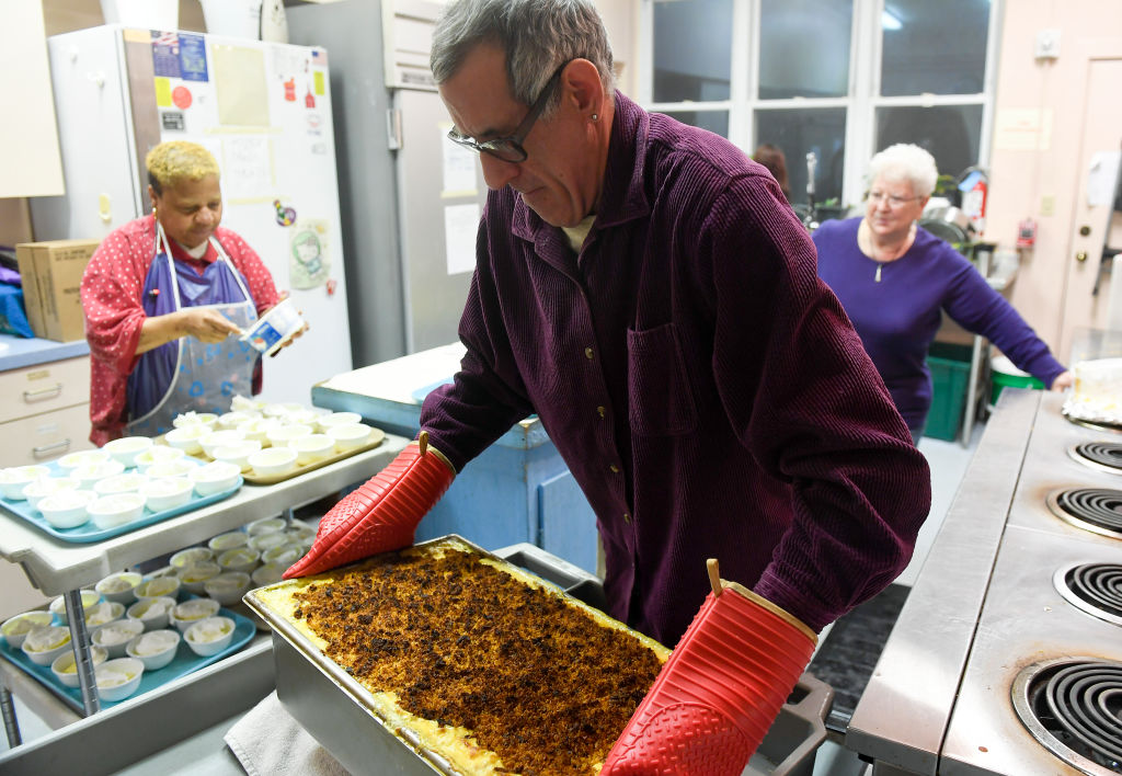 Weekly dinner volunteer John Estep of Reading moves a vat of macaroni and cheese in the church's kitchen. Hope Cafe, a new venture by Hope Lutheran Church, is planned to be a pay what you can restaurant in Reading, photographed on Tuesday, December 11, 20