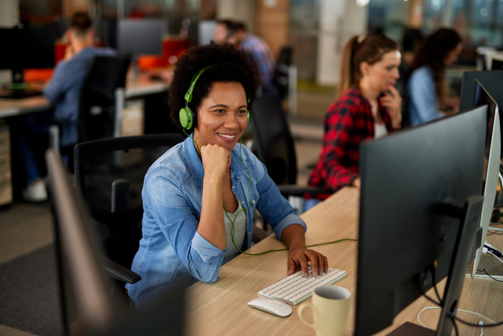 Portrait of female programmer working on computer