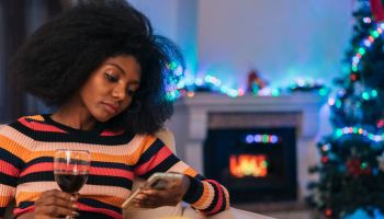 Bored woman spending Christmas alone at home