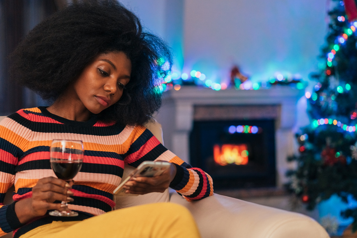 Bored woman spending Christmas alone at home