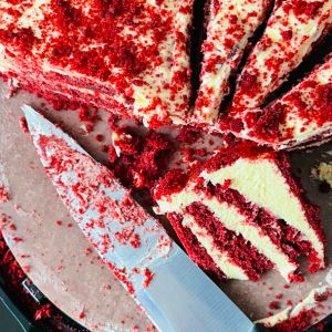 Red velvet cake slices with knife.