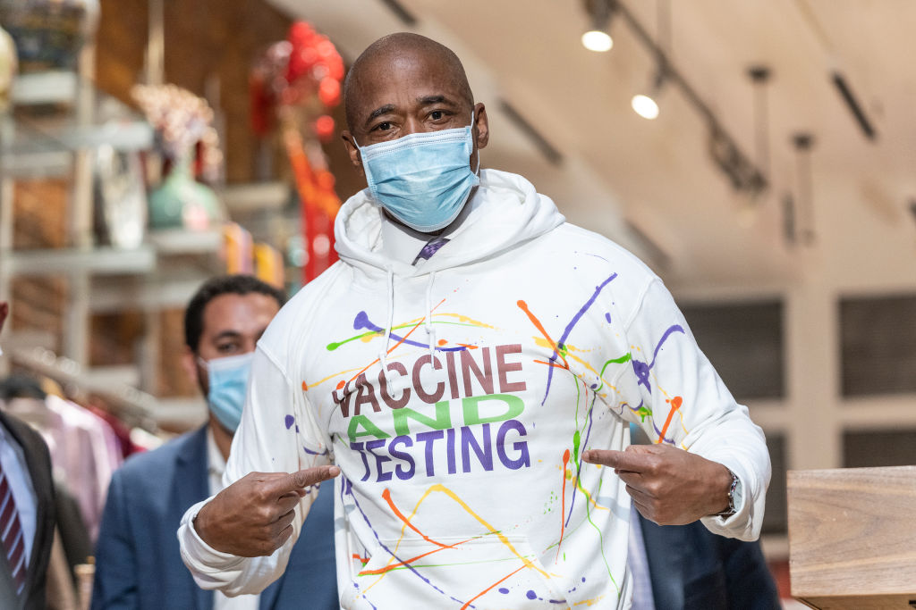 Mayor Eric Adams wears hoodie sweatshirt with slogan Vaccine...