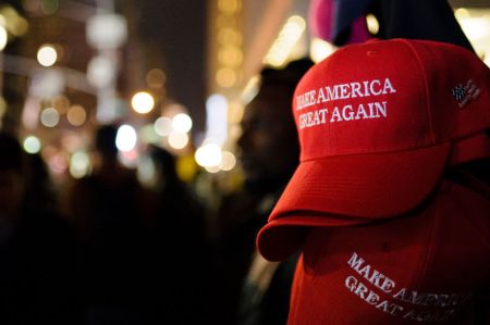 "Make America Great Again" red baseball caps, signature...