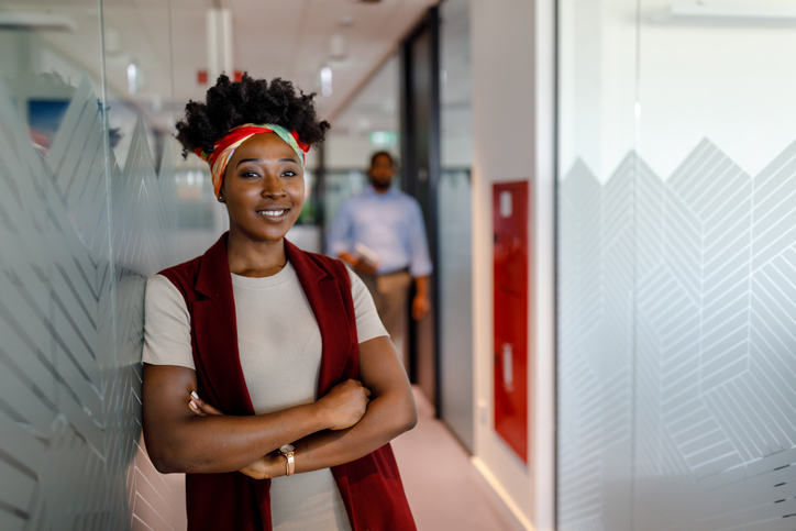 Beautiful African Businesswoman is Walking Through the Company and Feeling Satisfied.