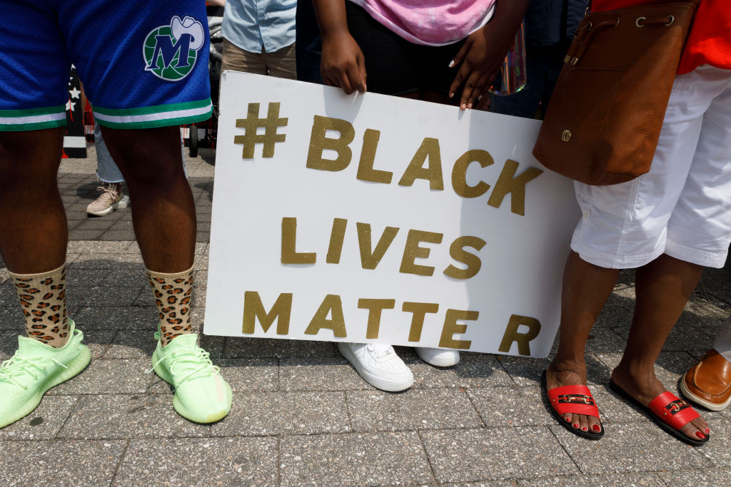 Supporters of Casey Goodson Jr. hold a # Black Lives Matter...