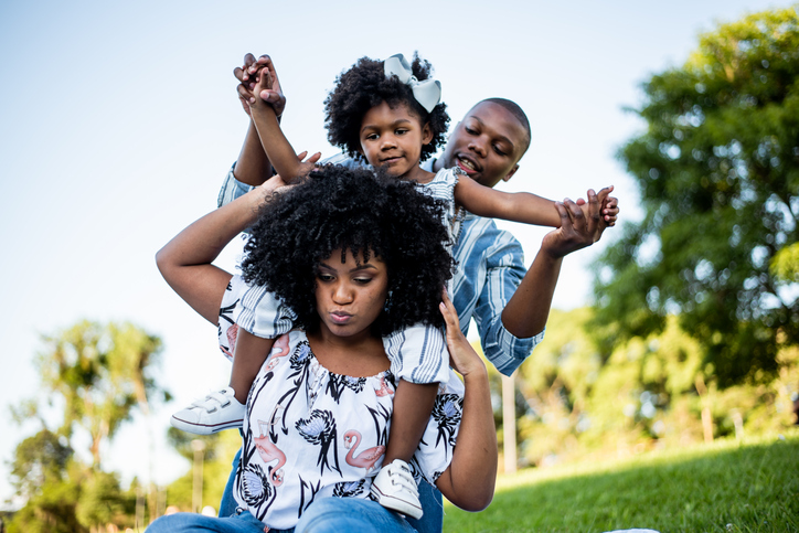 Black family having fun in the park