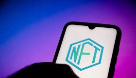 In this photo illustration, a NFT (Non-fungible token) logo...