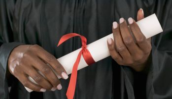 Female graduate holding diploma