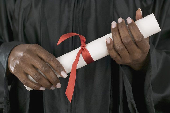 Female graduate holding diploma