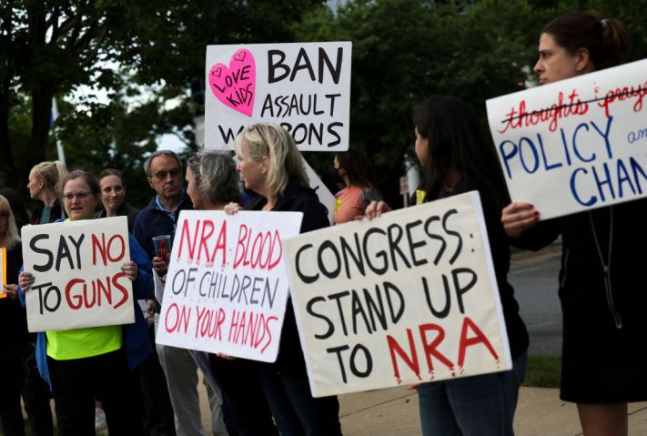 Vigil Held For Uvalde Shooting Victims Outside NRA Headquarters In Virginia