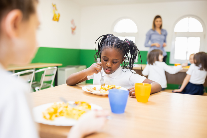 Primary school children on lunch break at school cafeteria