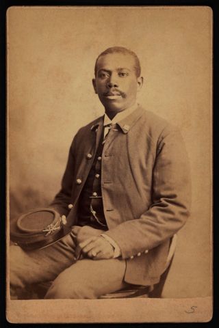 Buffalo Soldier, 25th Infantry, Seated Portrait in Uniform Holding Hat, by Orlando Scott Goff, William A Gladstone Collection of African American Photographs, 1880s