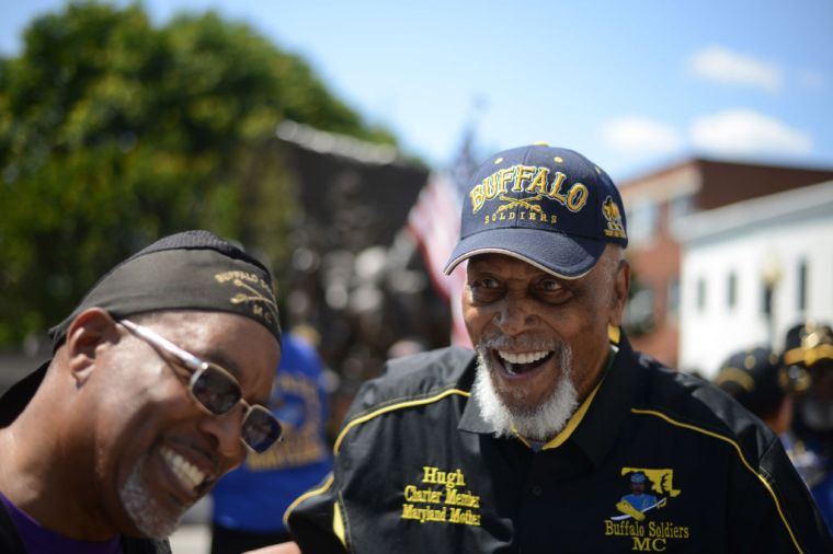 WASHINGTON, DC - MAY 29: Hugh Valentine, 91, right, laughs whil