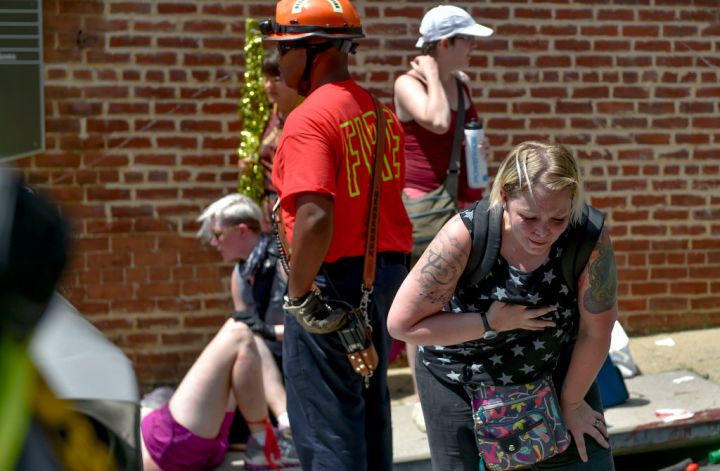 A woman appears to be injured during the State of Emergency.