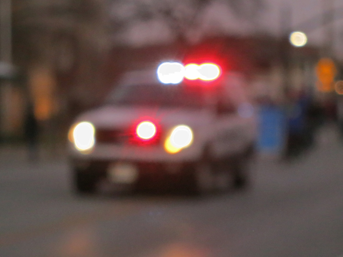 Out of focus view of a police SUV vehicle