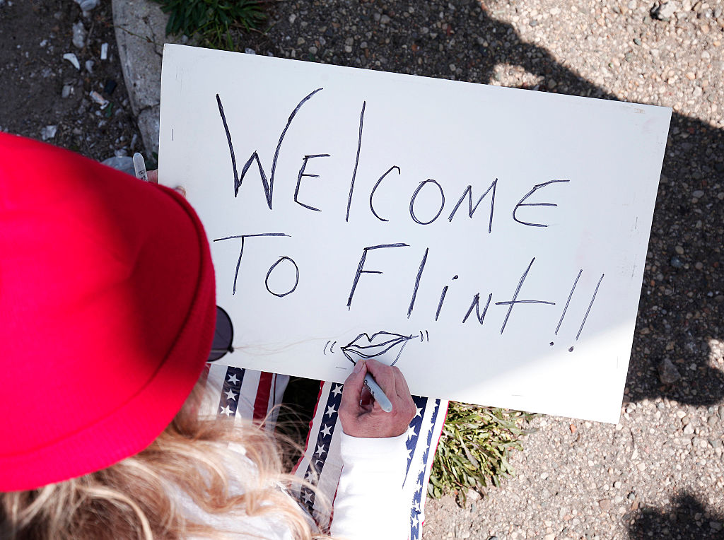 Protesters Demonstrate Against Donald Trump's Visit To Flint Michigan