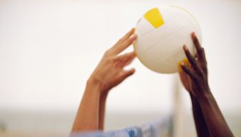 Hands Hitting Volleyball