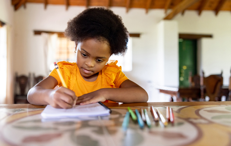 African American girl doing her homework at home