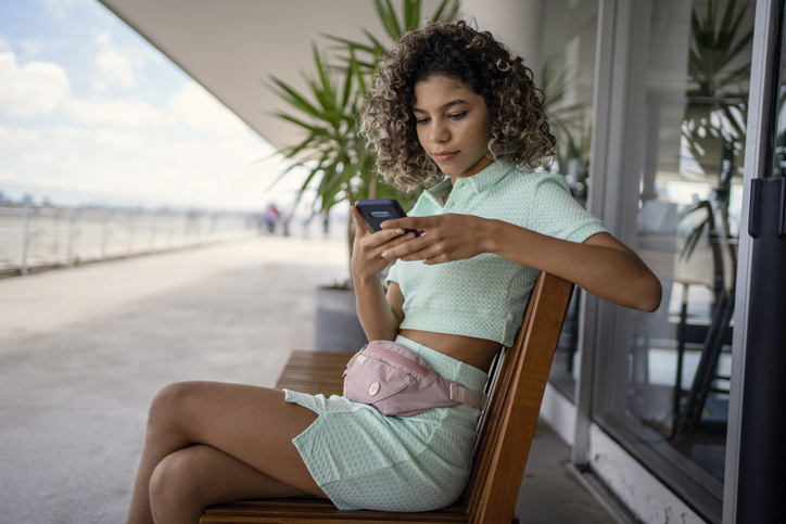 Teen age girl using smart phone