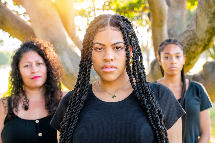 Afro-latinx young women posing with their mother