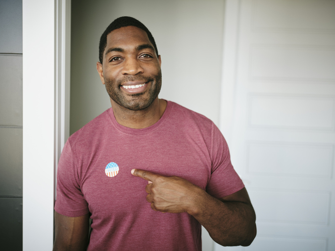 Man with I VOTED sticker