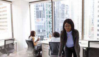 Portrait confident businesswoman working in highrise office