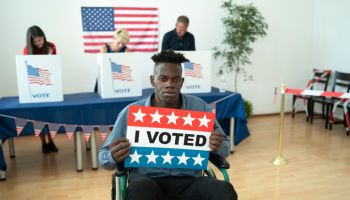 Young handicapped Afro-American man on Election Day