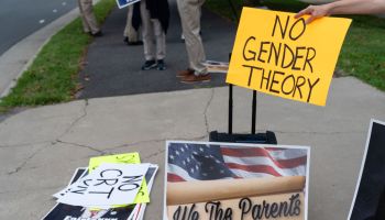 FALLS CHURCH, VA - JULY 17: A woman holds a no gender theory si