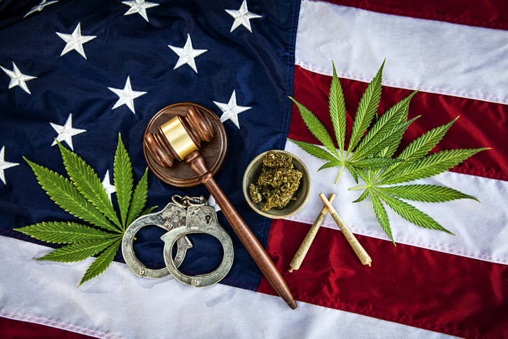 Cannabis on American Flag with Handcuffs and gavel