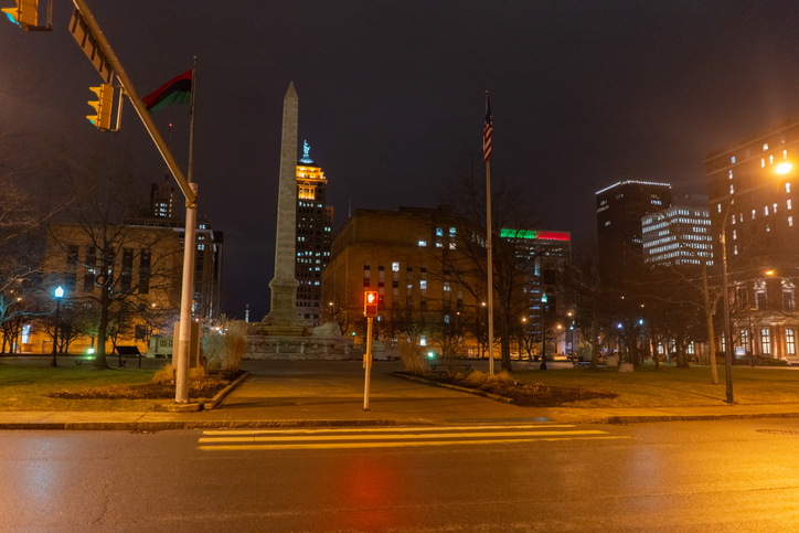 Niagara Square with the lights on during the night in Buffalo in New York