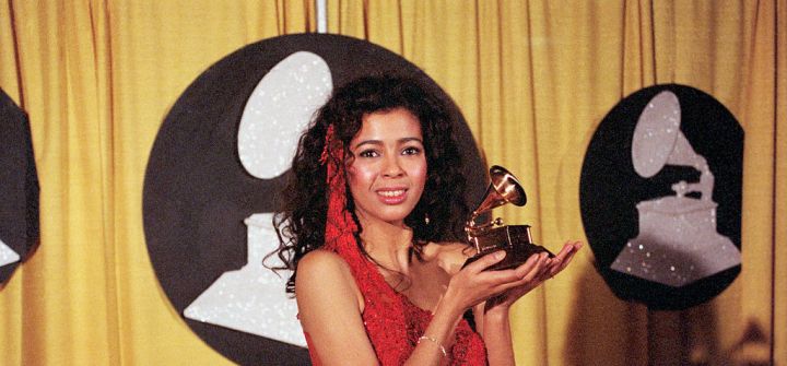 Irene Cara Holding Grammy Award