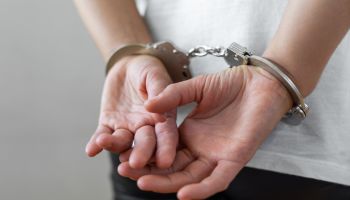 Criminal wearing handcuffs
