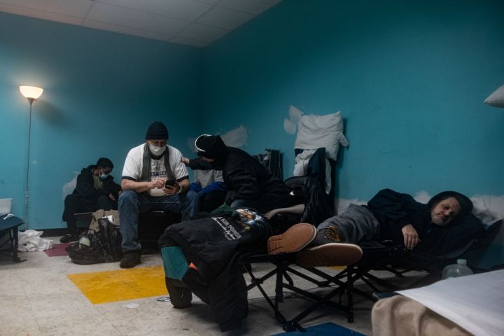 People spend time in one of many warming shelters set up around