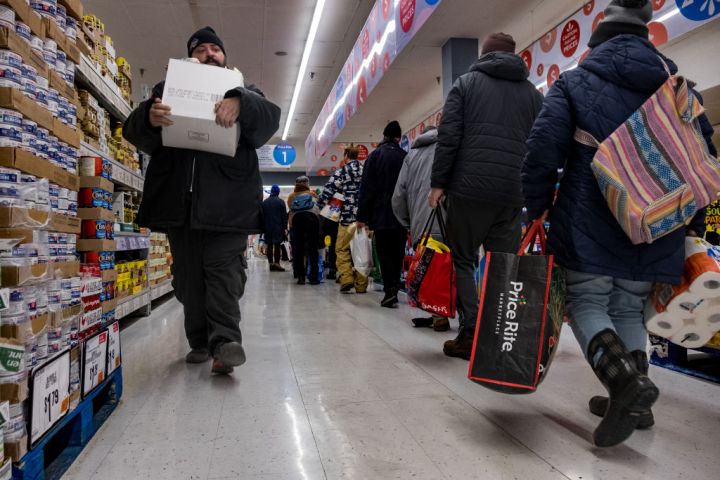 People grab supplies , food and etc after the blizzard left mna