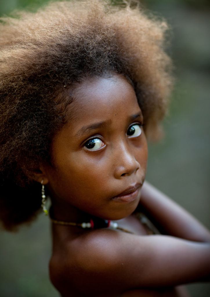 Portrait of an islander girl with blonde hair, Milne Bay Province, Trobriand Island, Papua New Guinea...