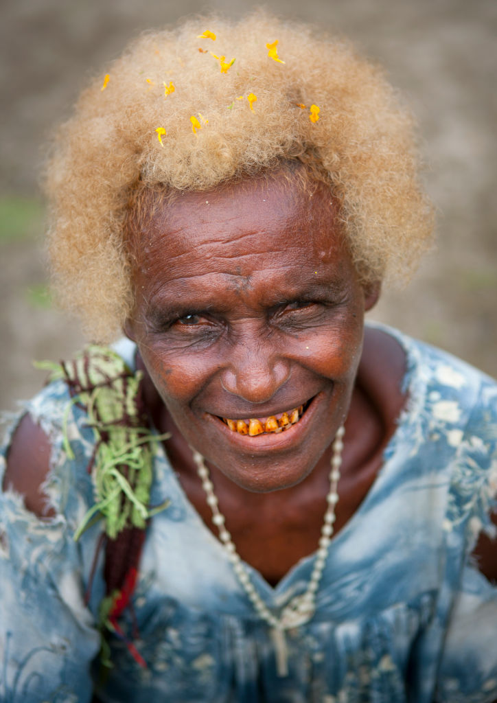 Old woman with pollens in her blonde hair, New Ireland Province, Langania, Papua New Guinea...