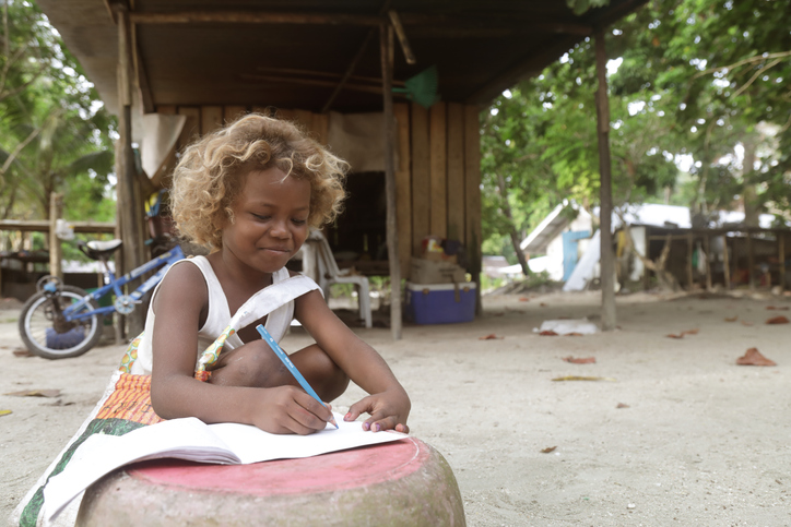 Pacific Island child doing homework